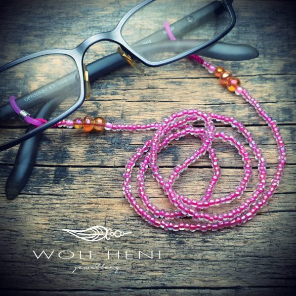 Szivárványosan csillogó gyerek szemüveglánc, mint táncoló buborékok a fényben